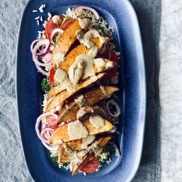 Sweet potato wedges with tomato, onion and brown rice salad